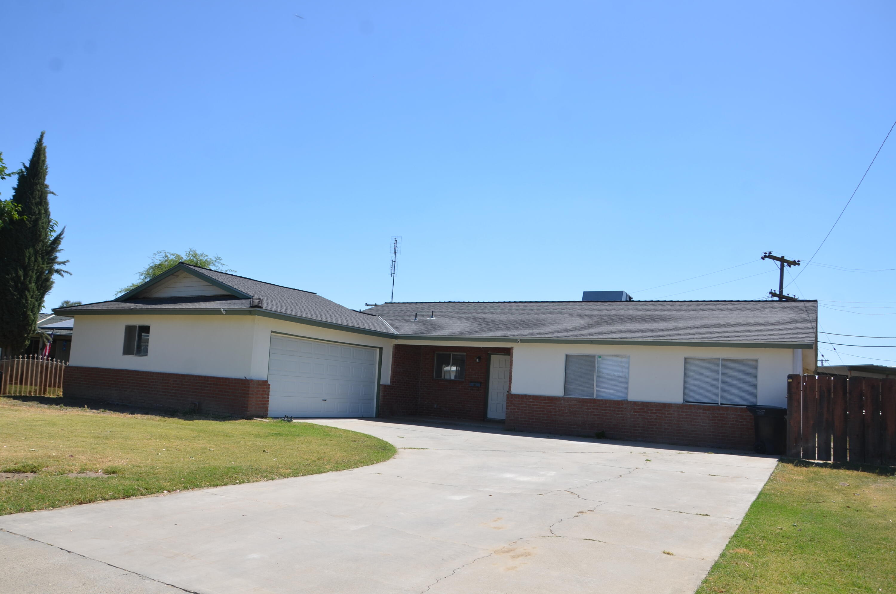 339 West Spring Lane Lemoore, CA 93245 - Photo 30 of 31 a front view of a house with a garden