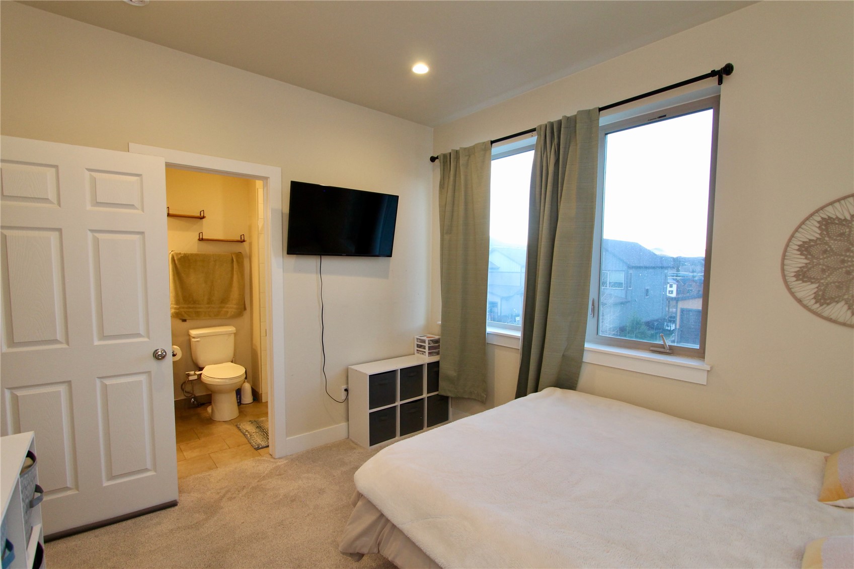 54 Haymaker Street, Unit 54 Silverthorne, CO 80498 - Photo 13 of 21 a bedroom with a bed and a flat screen tv