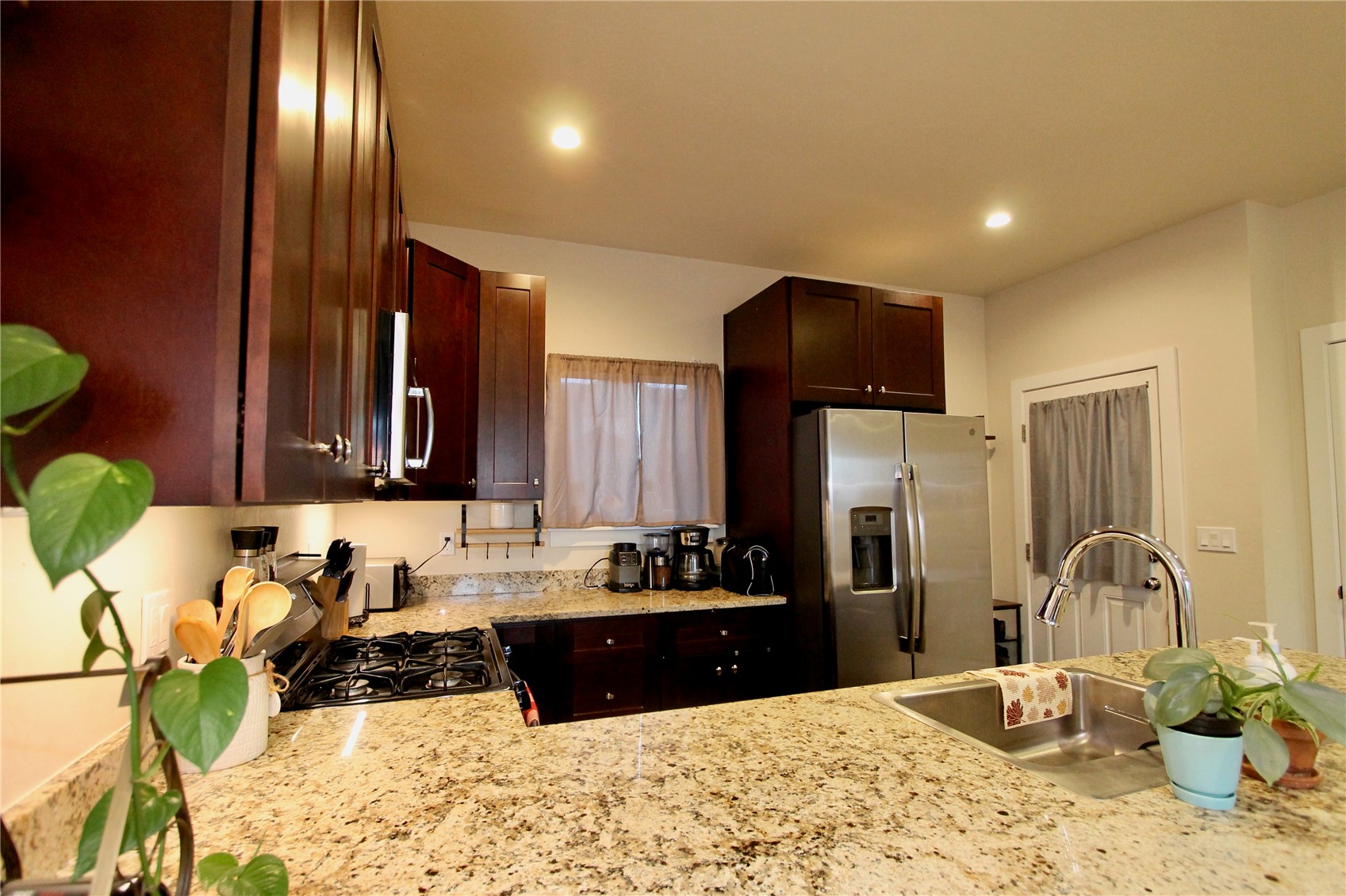 54 Haymaker Street, Unit 54 Silverthorne, CO 80498 - Photo 19 of 21 a kitchen with a refrigerator and a sink