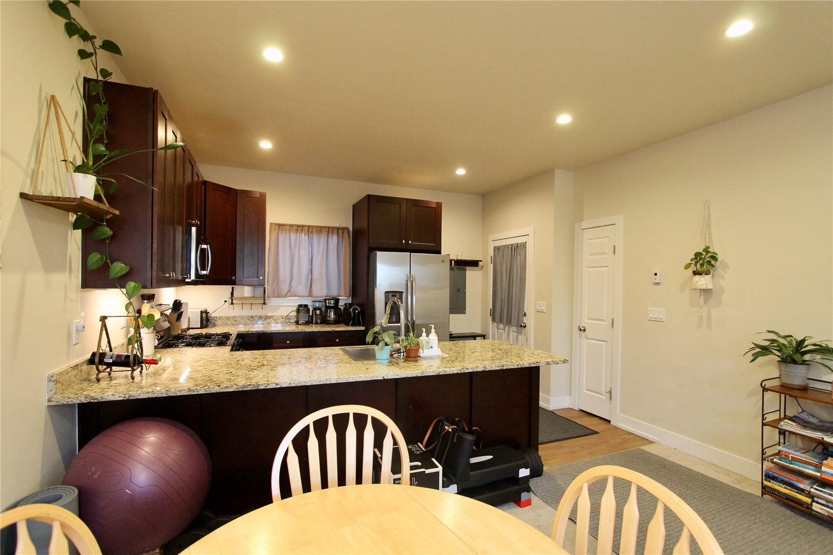 54 Haymaker Street, Unit 54 Silverthorne, CO 80498 - Photo 3 of 21 a large kitchen with a table and chairs