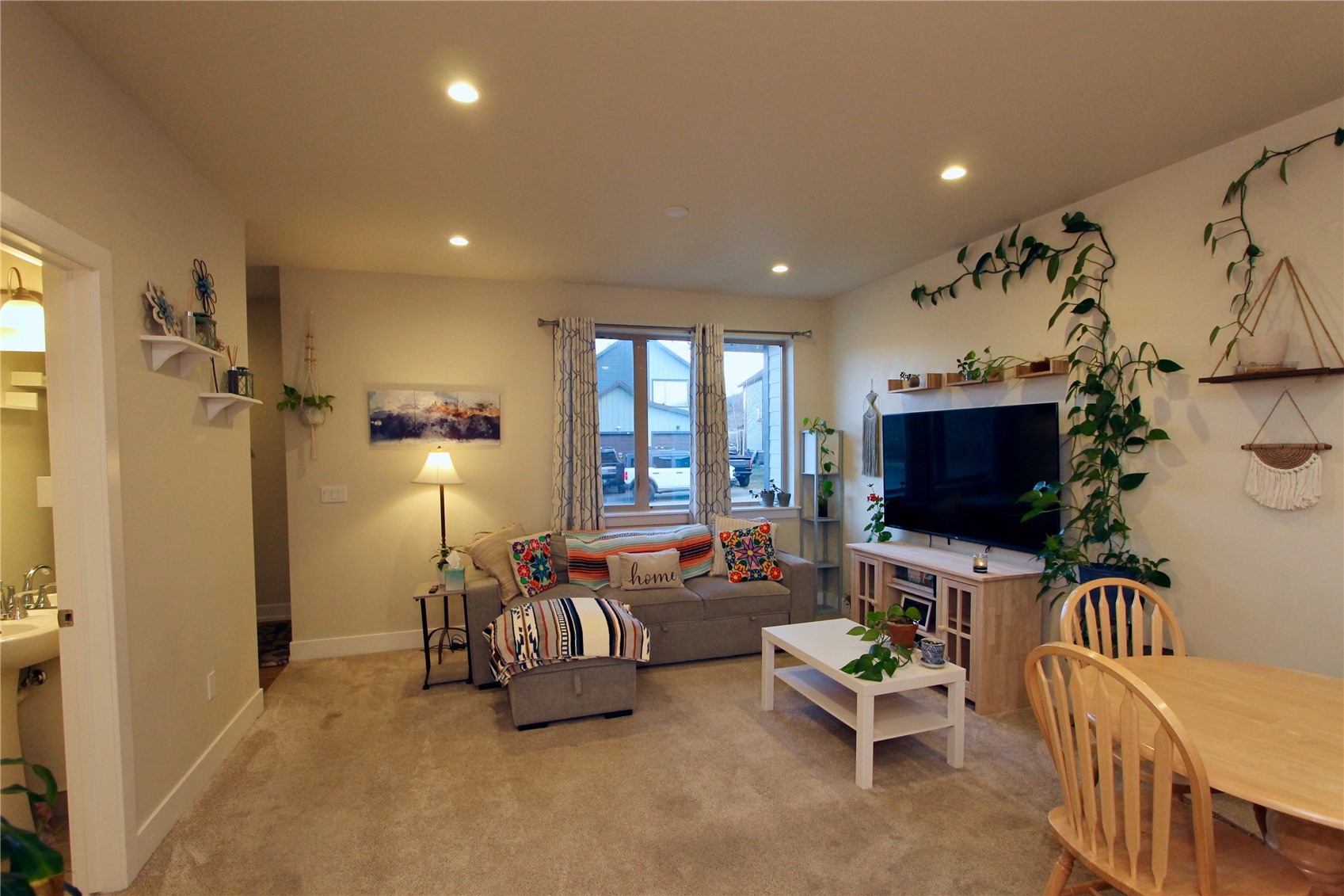 54 Haymaker Street, Unit 54 Silverthorne, CO 80498 - Photo 4 of 21 a living room with furniture and a flat screen tv
