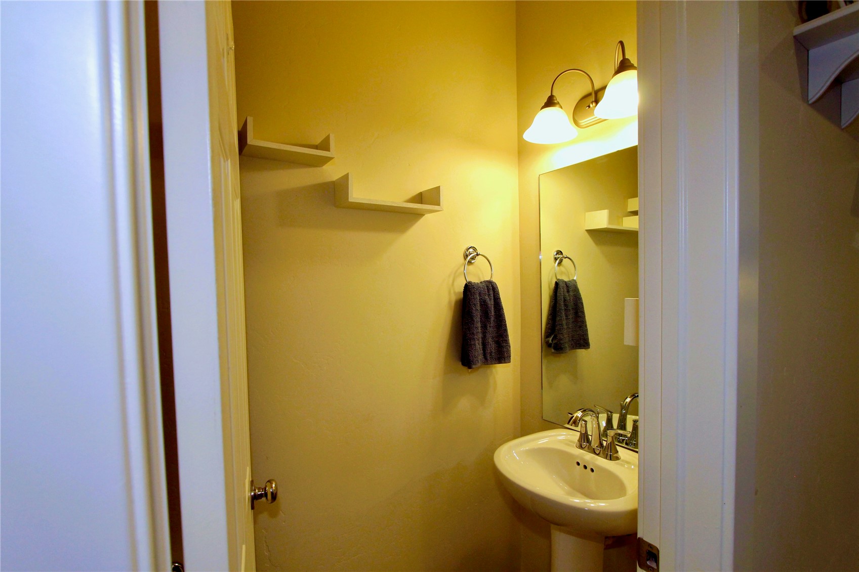 54 Haymaker Street, Unit 54 Silverthorne, CO 80498 - Photo 5 of 21 a bathroom with a sink and mirror