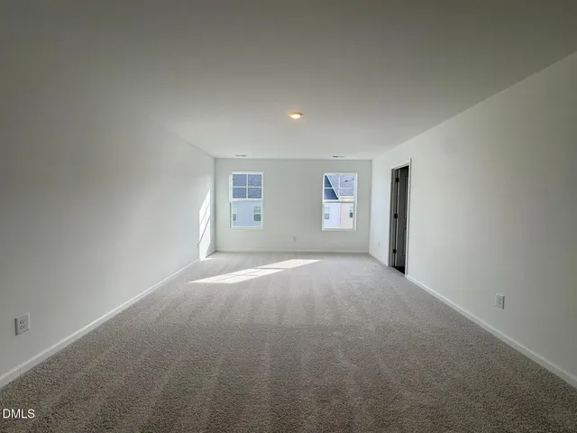 a view of empty room with windows