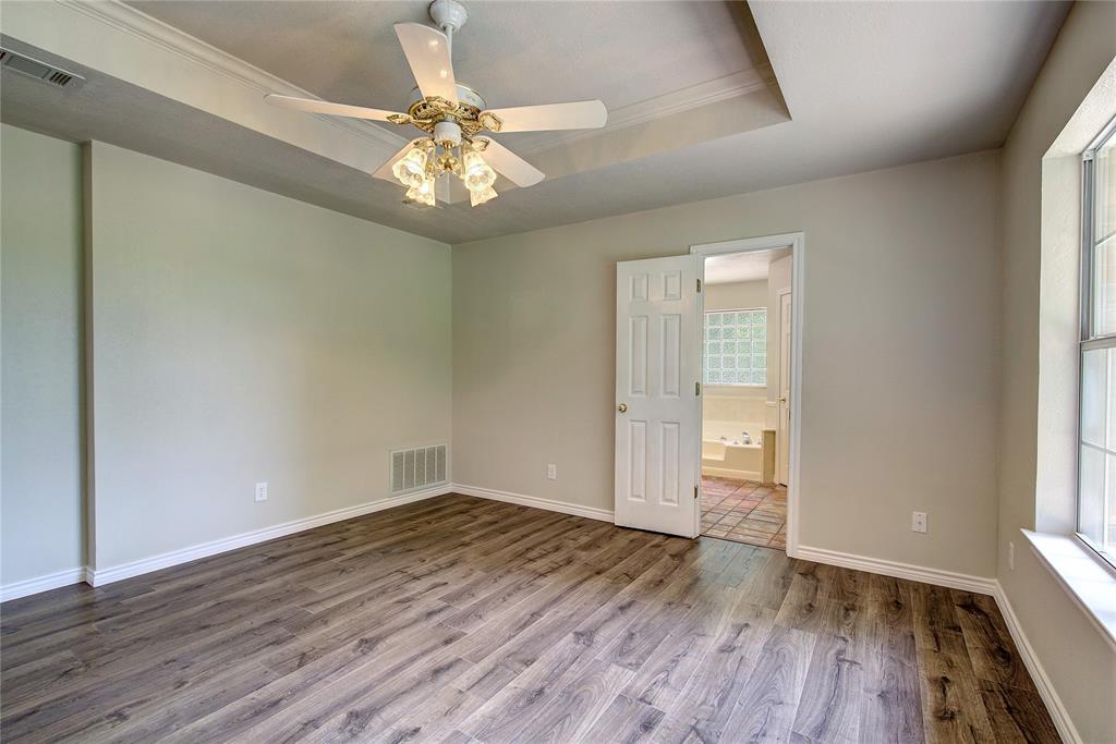 225 Rs County Road 1278 Emory, TX 75440 - Photo 28 of 36 wooden floor in an empty room with a window