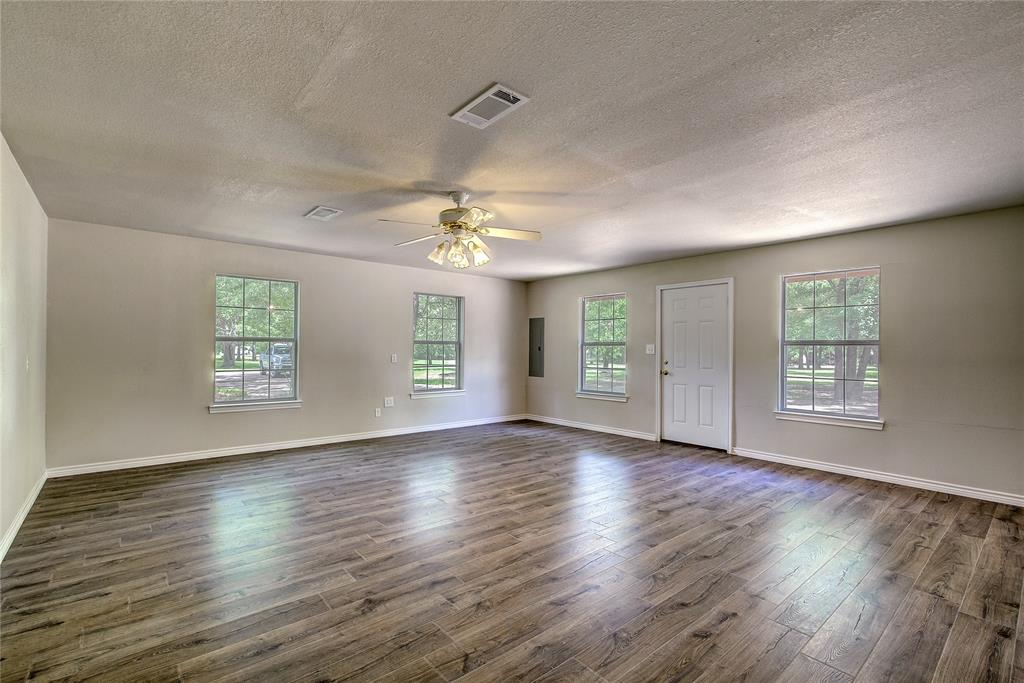 225 Rs County Road 1278 Emory, TX 75440 - Photo 34 of 36 a view of an empty room with wooden floor and a window