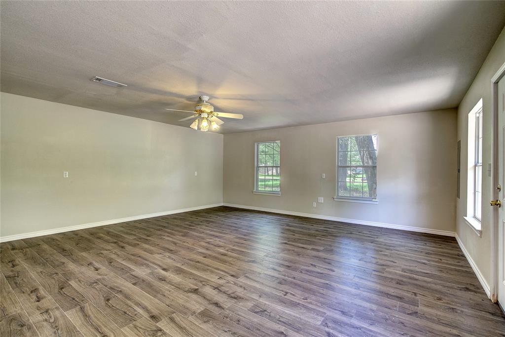 225 Rs County Road 1278 Emory, TX 75440 - Photo 35 of 36 an empty room with wooden floor and window