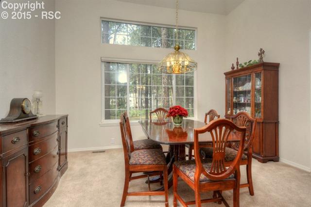 875 Bend In The Trail Road Monument, CO 80132 - Photo 8 of 36 Formal dining room, perfect for the holidays and those fun dinner parties