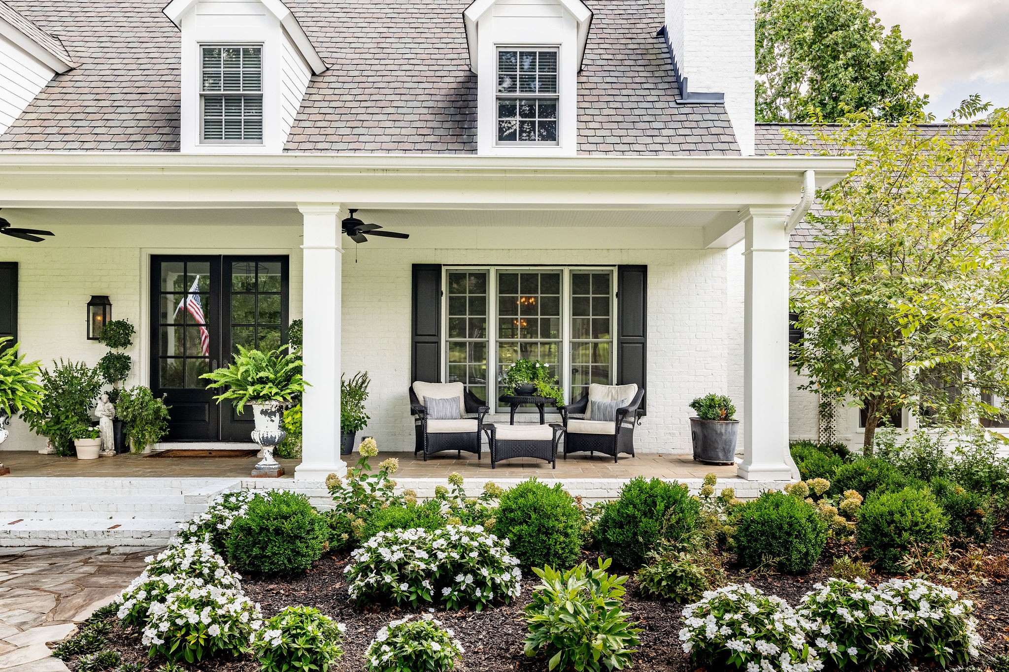 5178 Old Harding Road Franklin, TN 37064 - Photo 3 of 70 front view of a house with a bench and potted plants