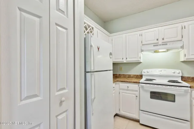 a view of an empty room with a fireplace