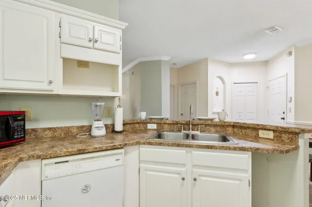 a living room with furniture a fireplace and a ceiling fan