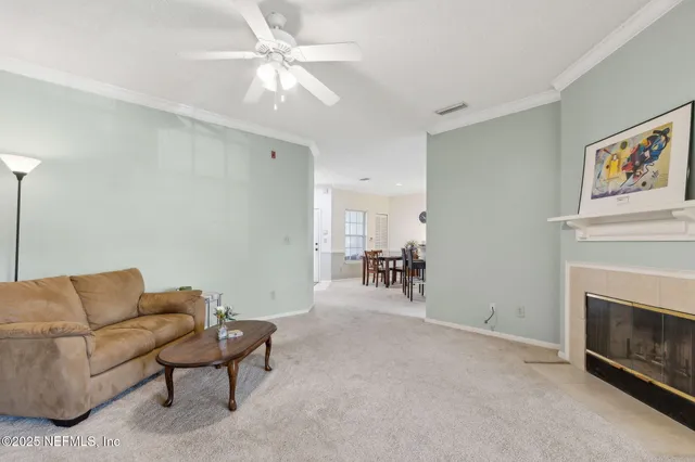 an empty room with a flat screen tv and a window