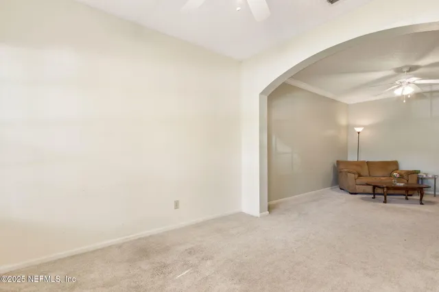 a bathroom with a sink a toilet a mirror and shower curtain