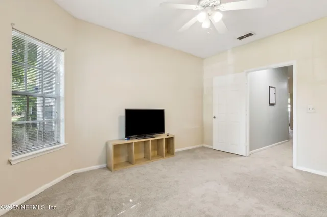 a bathroom with a sink a toilet and a large mirror