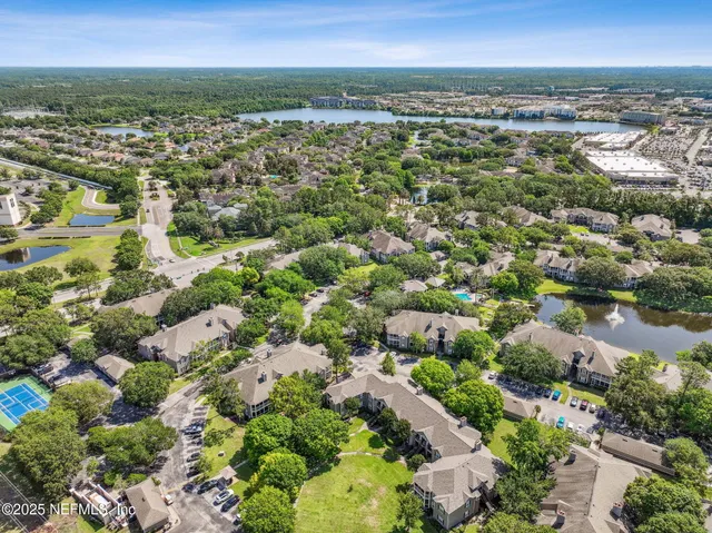 a front view of a house with garden and porch