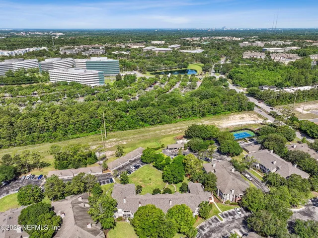 a view of backyard with sitting area and slide