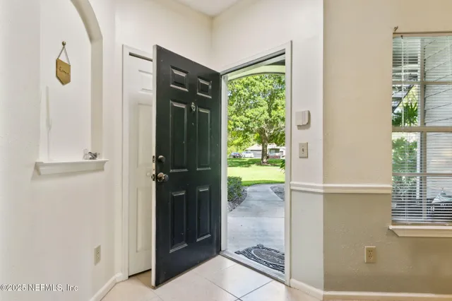 a kitchen with a table and chairs in it