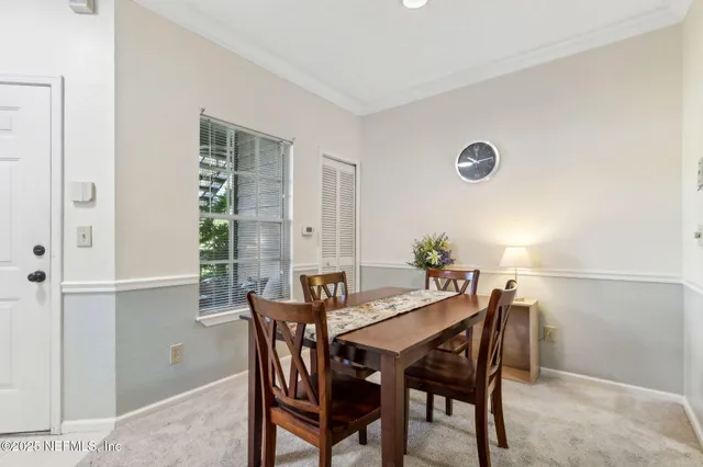 a kitchen with granite countertop a sink white cabinets and white appliances