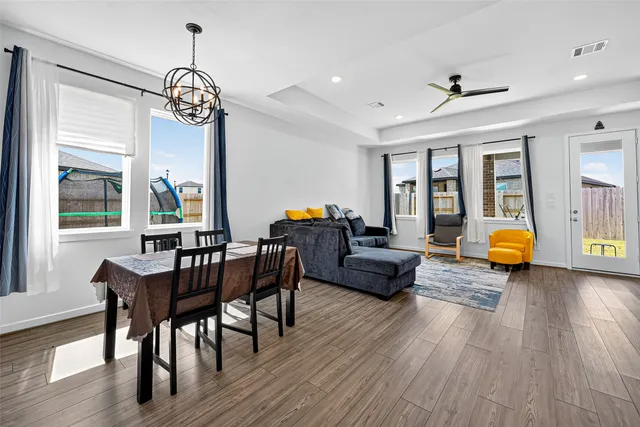 a view of a dining room with furniture window and wooden floor