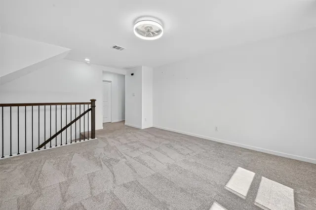 a view of a hallway with staircase