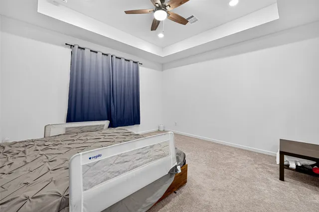 a room with a bed and a chandelier