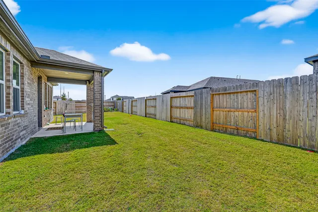 a view of a backyard of the house