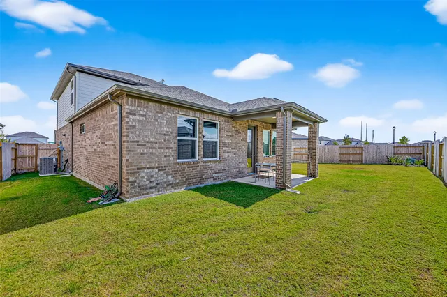 a front view of a house with yard and porch