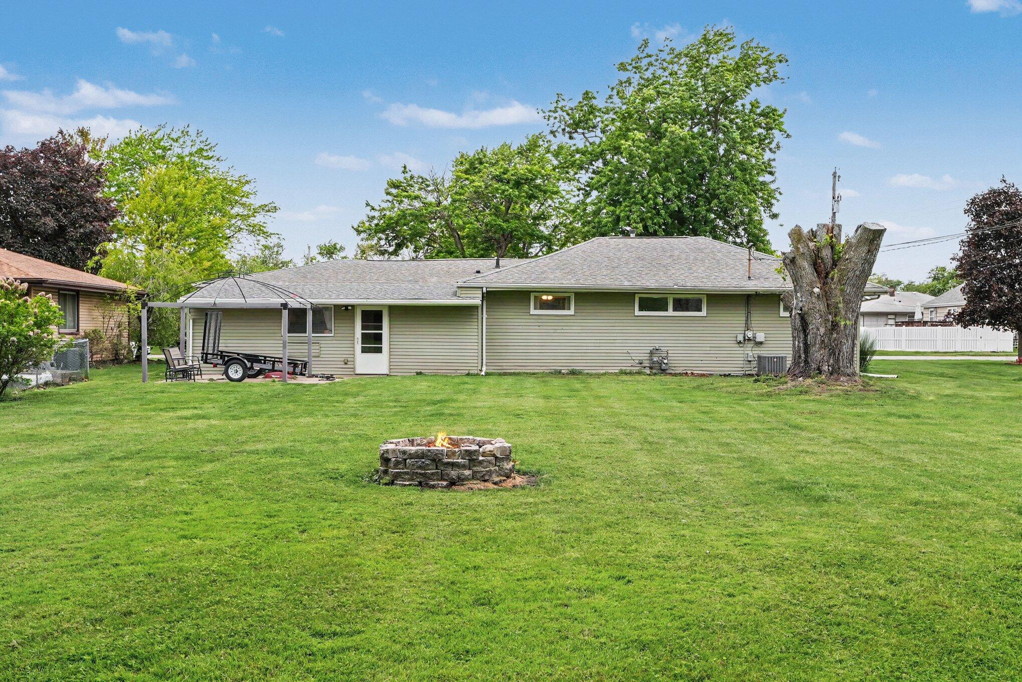 835 North Indiana Street Griffith, IN 46319 - Photo 19 of 19 a front view of a house with a garden
