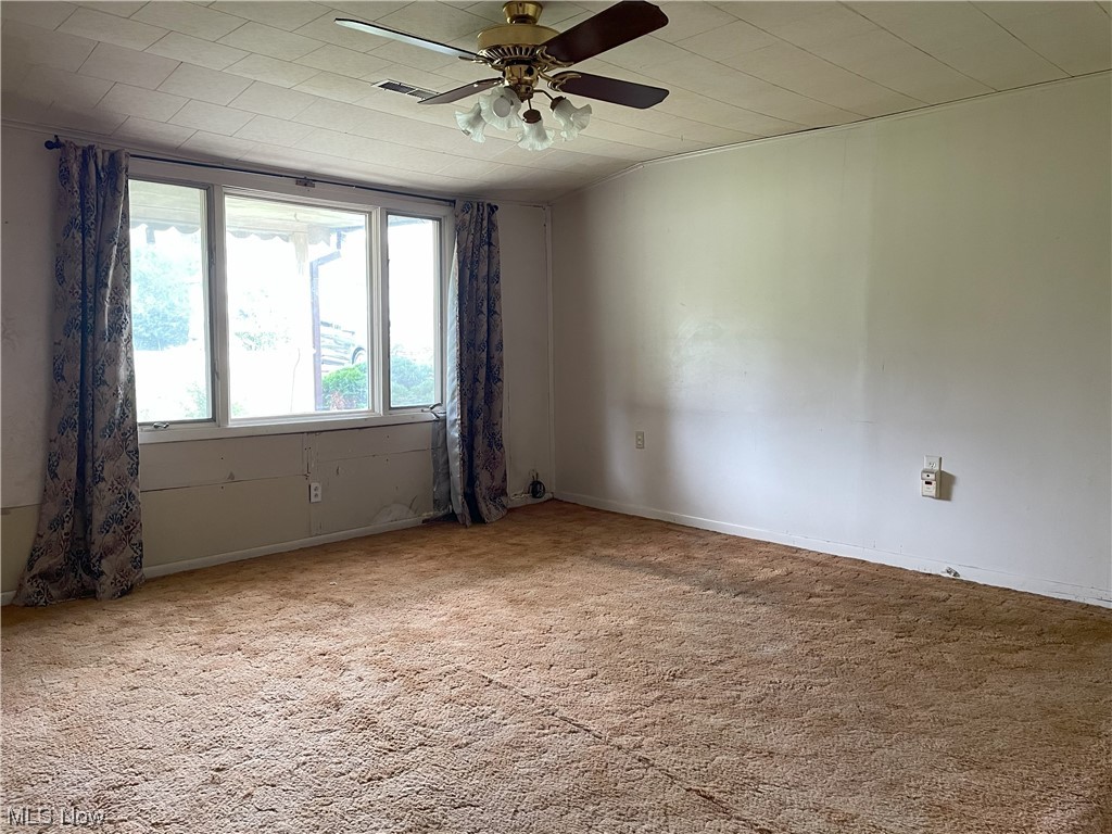 4107 Jaeger Road Lorain, OH 44053 - Photo 8 of 33 Spare room featuring light colored carpet and ceiling fan