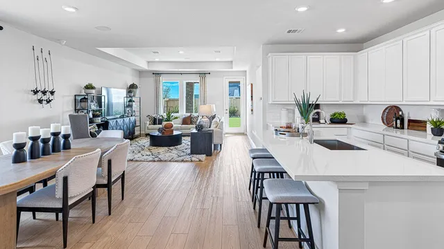 a view of a kitchen and dining room