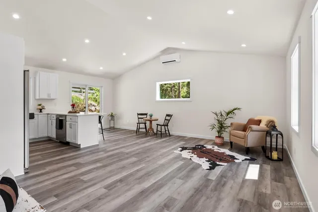 a living room with furniture and a table