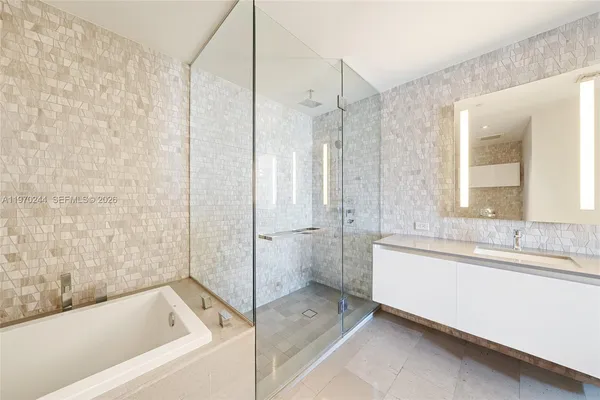 a bathroom with a bathtub and a sink