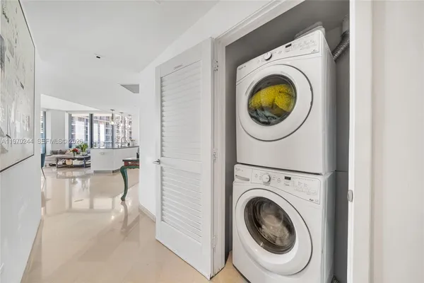 a view of a hallway with washer and dryer