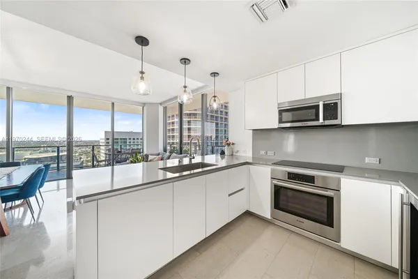 a kitchen with a sink and cabinets