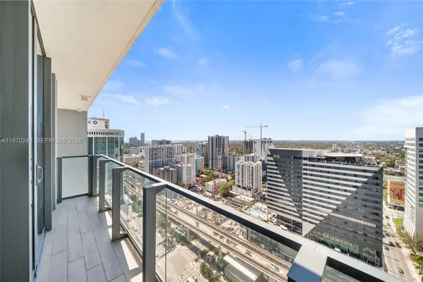 a view of a balcony with wooden floor