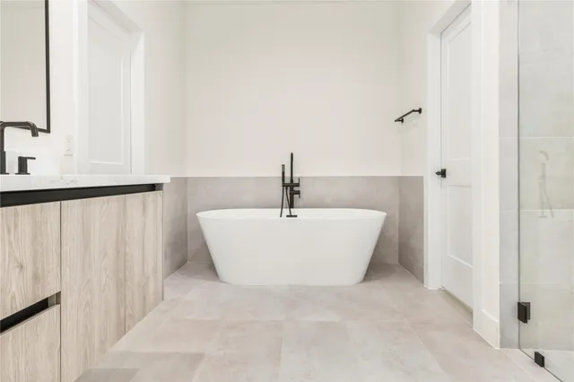 a white bath tub sitting in a bathroom