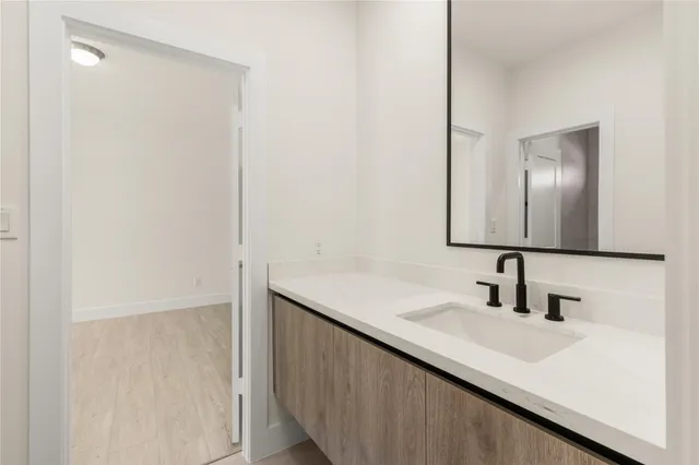 a bathroom with a sink and a mirror