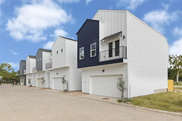a front view of a house with a garage