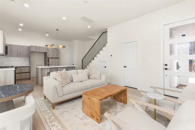 a living room with furniture and a rug