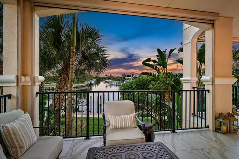 a view of a balcony with couches and wooden floor