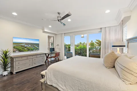 a large bedroom with a large bed and a large window