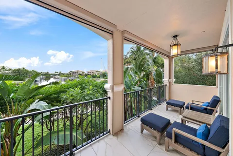 a view of a balcony with furniture