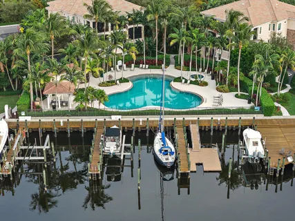 a view of a chairs and table in patio
