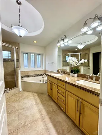 a large kitchen with kitchen island a large counter space cabinets and stainless steel appliances