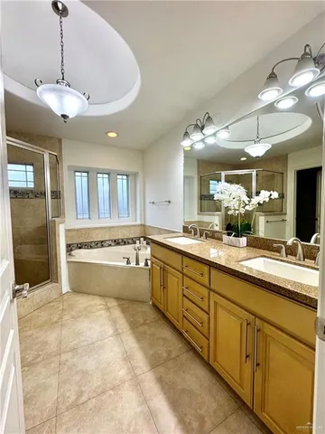 a large kitchen with kitchen island a large counter space cabinets and stainless steel appliances