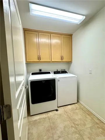 a kitchen with stainless steel appliances a stove and a microwave