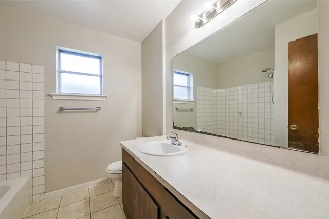 a bathroom with a sink a vanity and a mirror