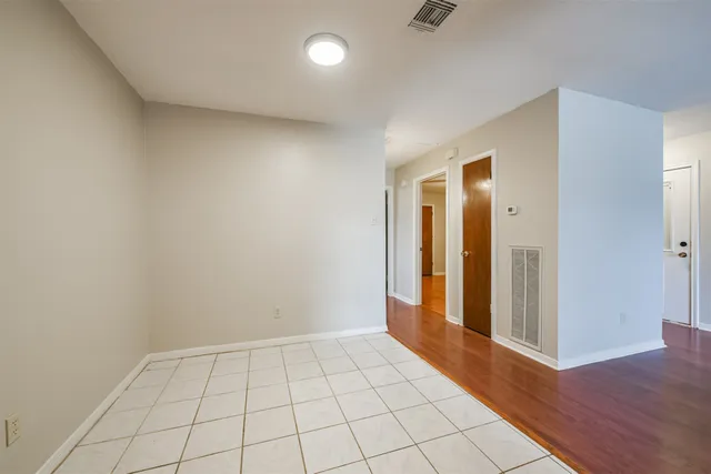 a view of an empty room and window