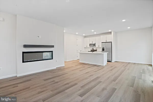 a view of a kitchen with a sink and a stove top oven