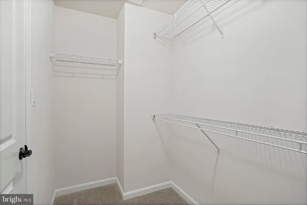 a view of a room with racks on the wall