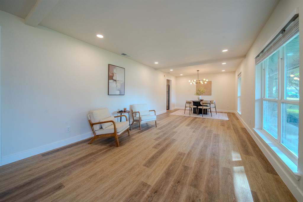 5125 Ashbrook Road Dallas, TX 75227 - Photo 4 of 34 Recessed lighting illuminates the wood-finish flooring and white baseboards